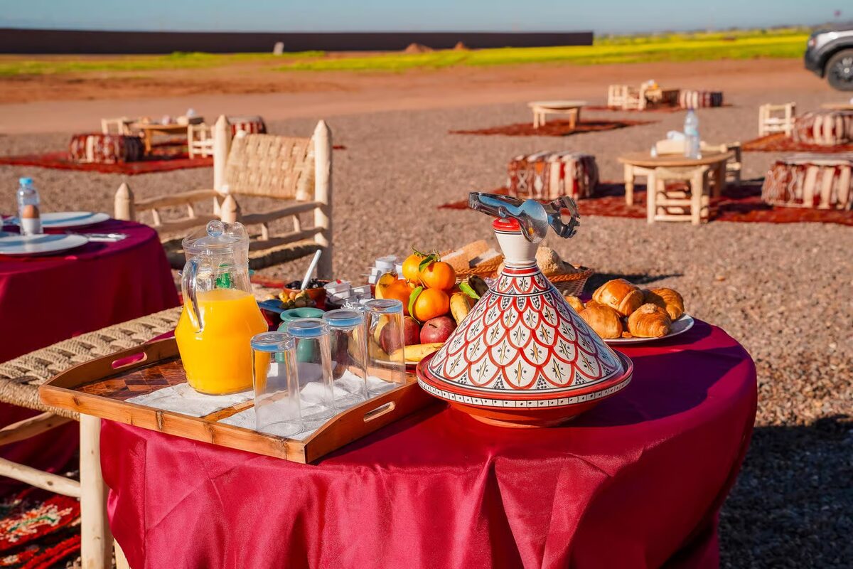Traditional Berber breakfast table with tea, juice and pastries