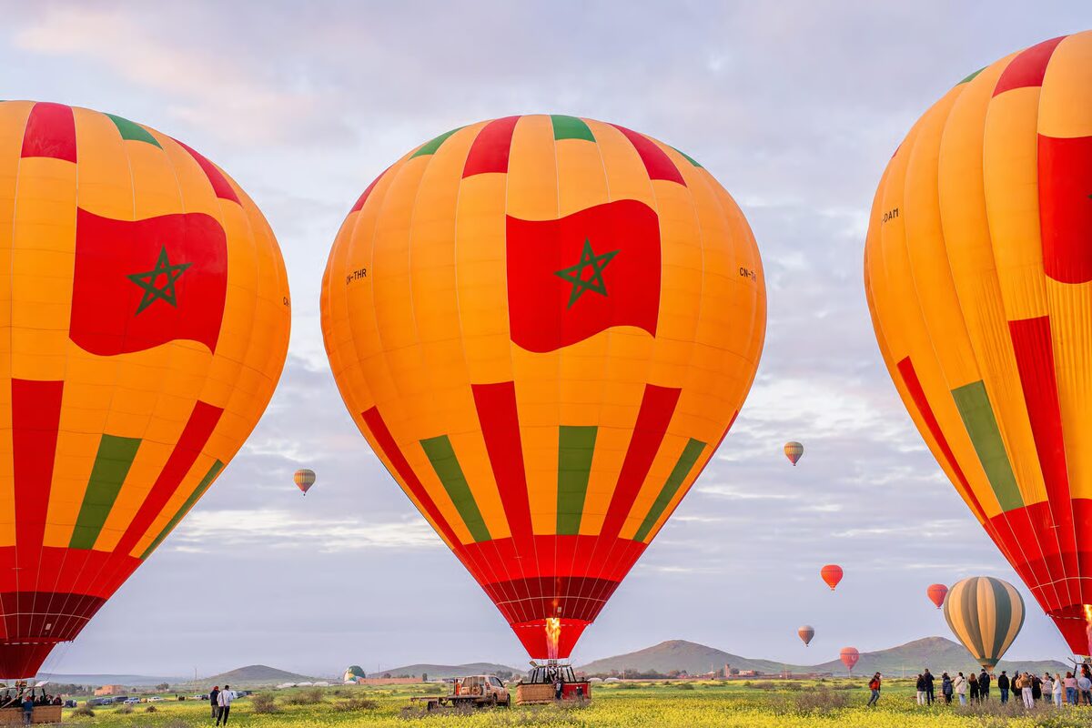 Colorful balloons painted with the Moroccan flag at take-off