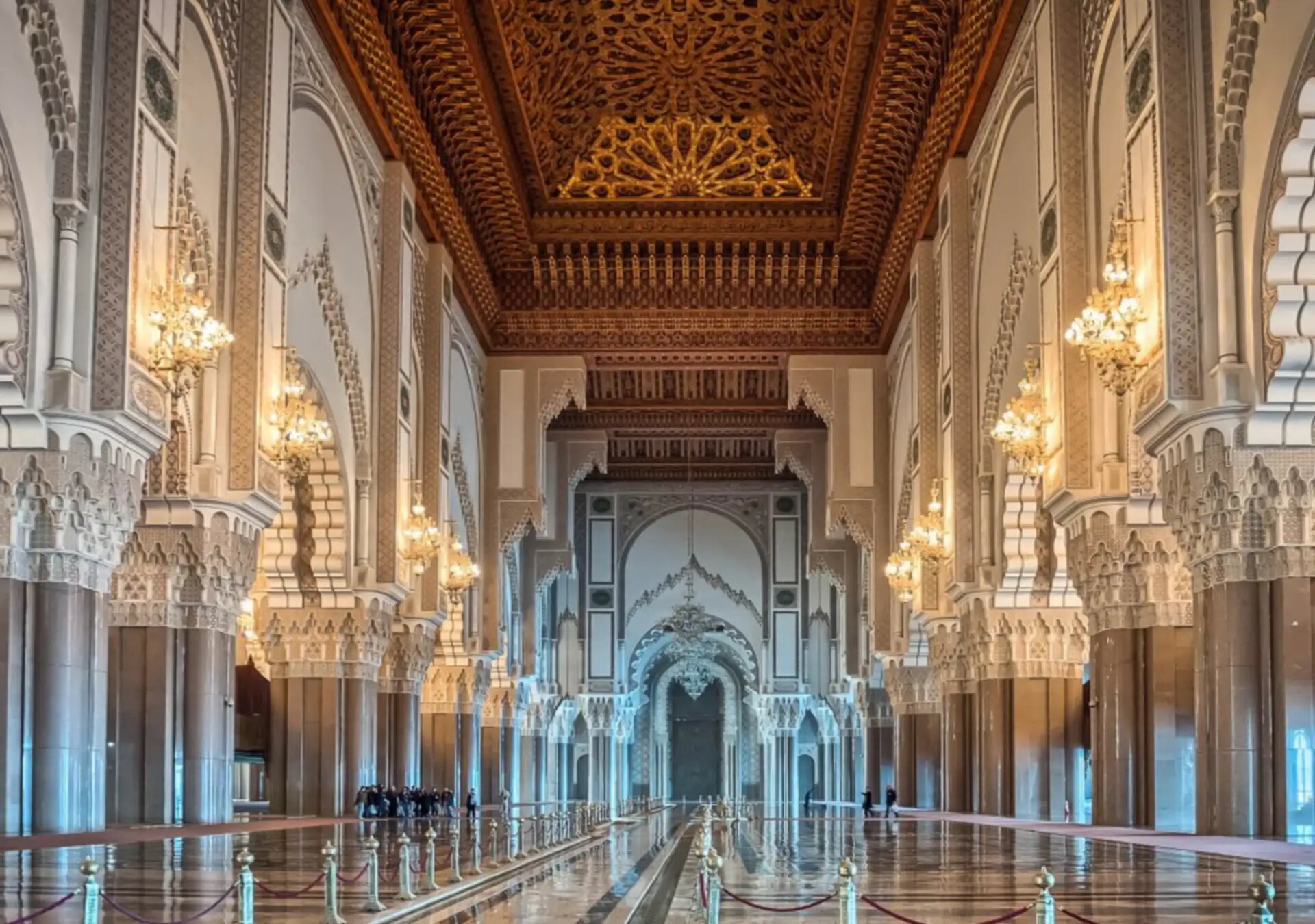 Carved cedar ceiling, chandeliers and arches of the Hassan II Mosque prayer hall