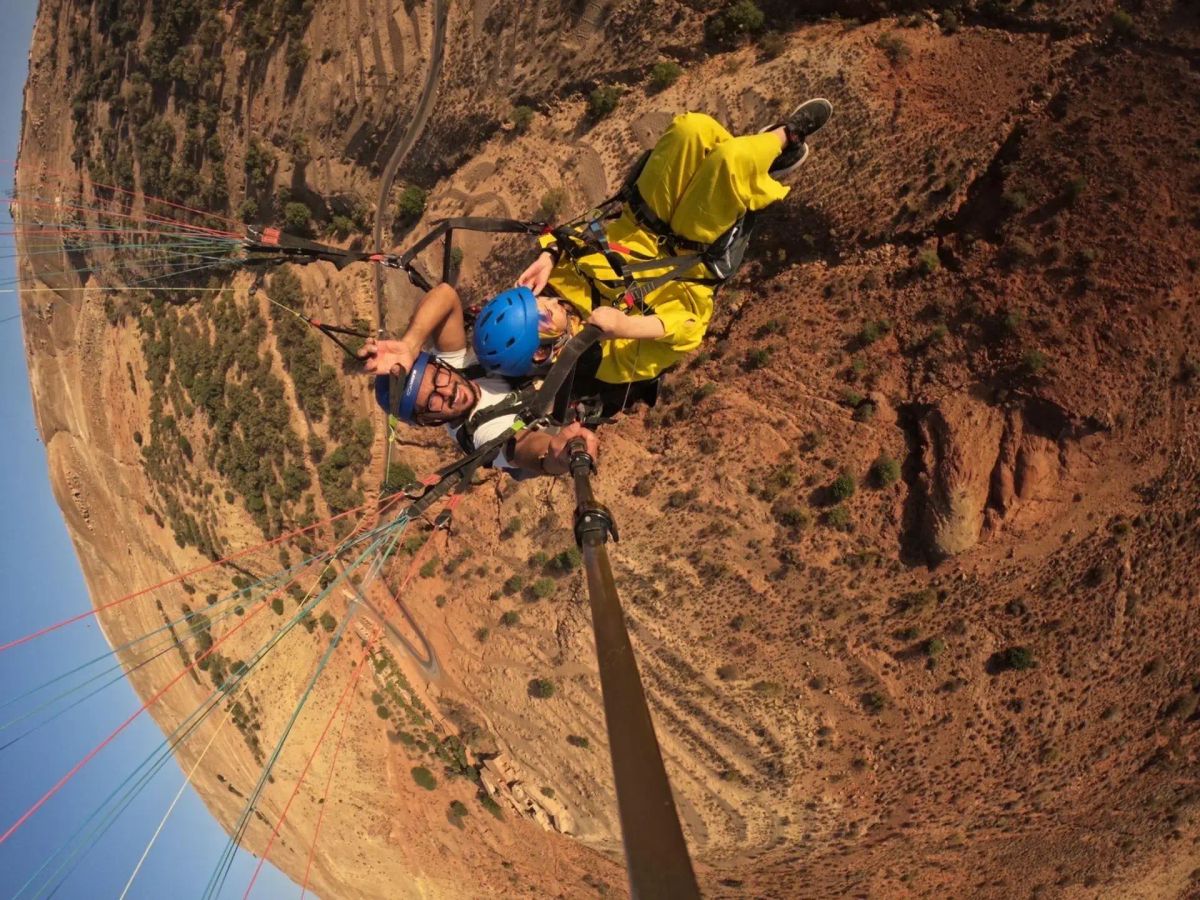 Upside-down GoPro selfie during an acrobatic tandem paragliding flight