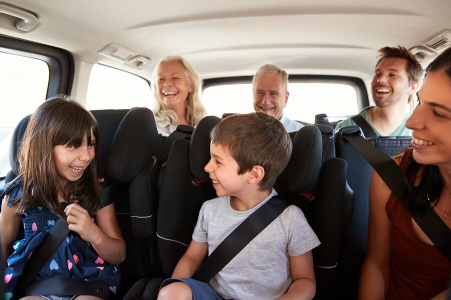 Family traveling together in a spacious private vehicle