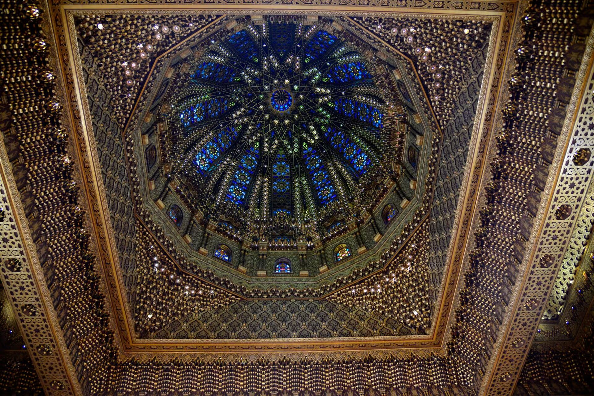 Ornate carved and gilded dome ceiling inside the Mausoleum of Mohammed V