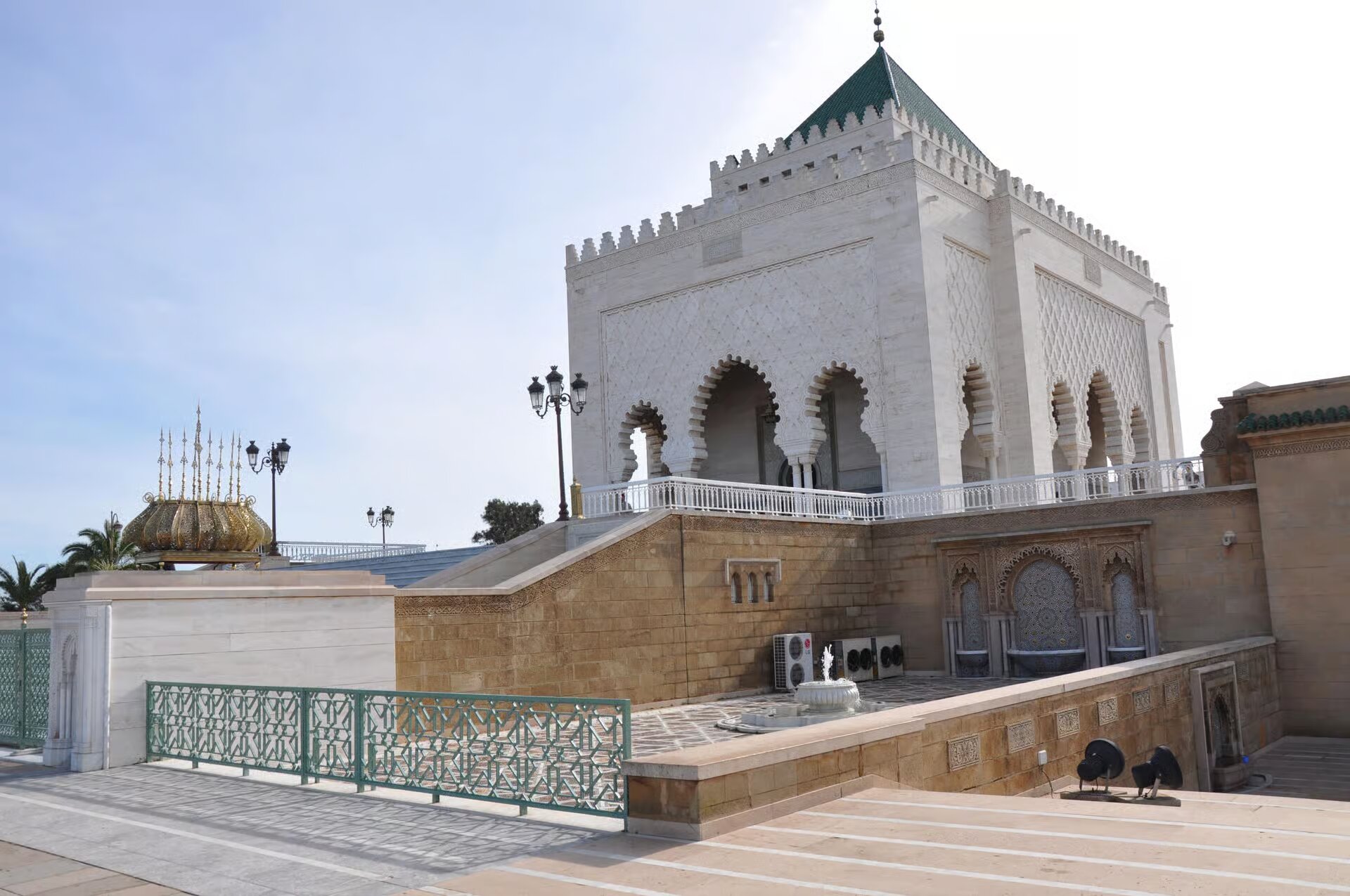 White marble Mausoleum of Mohammed V with its green-tiled roof in Rabat